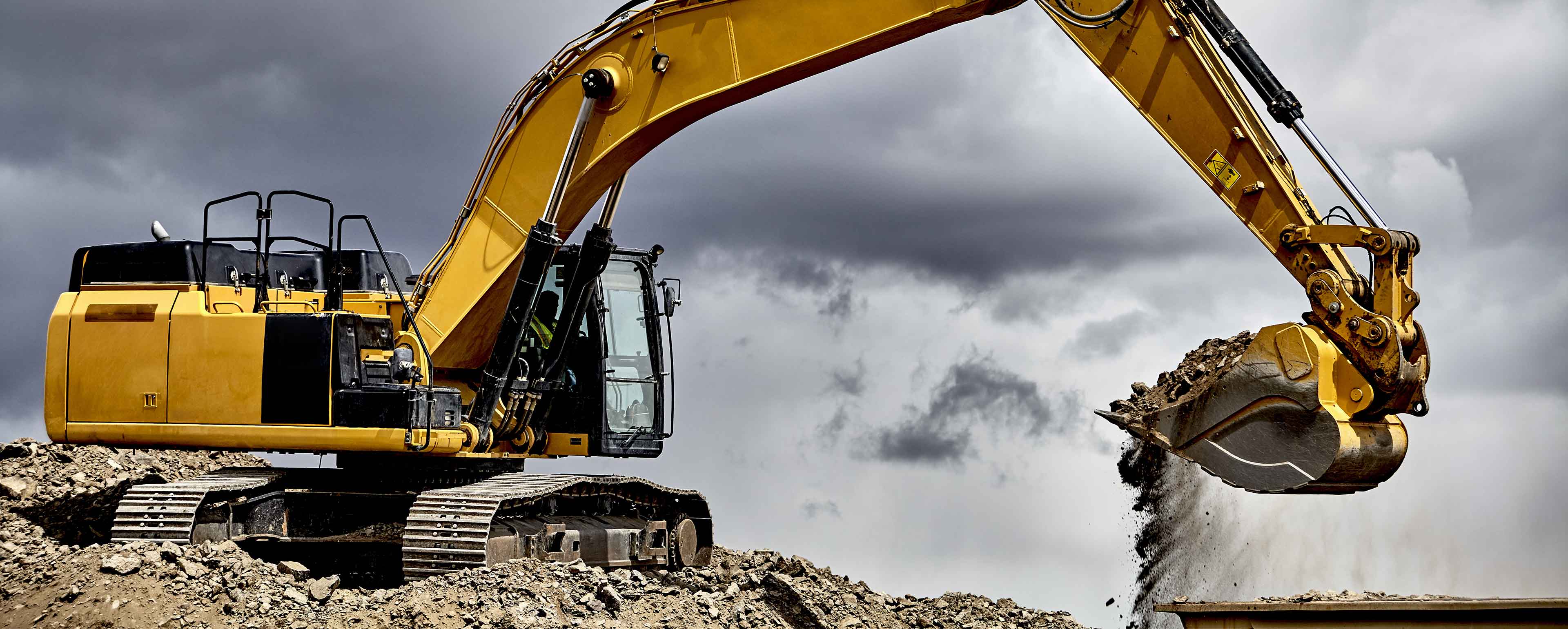 Baumaschinen, Bauarbeiten Bagger, Steine